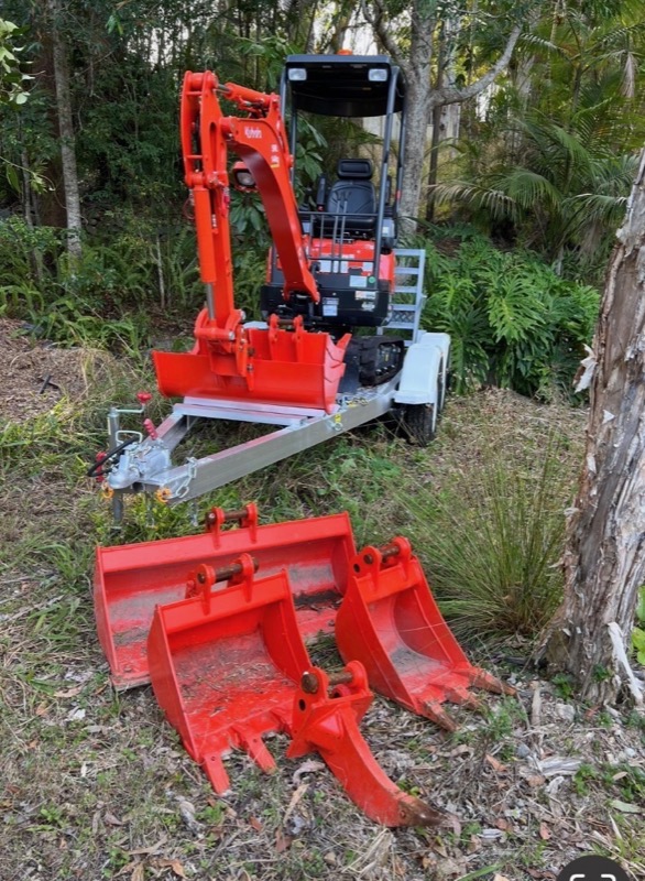 Mini excavator with multiple bucket attachments
